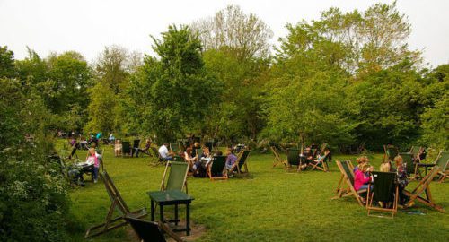 summer school students enjoying tea in orchard gardens