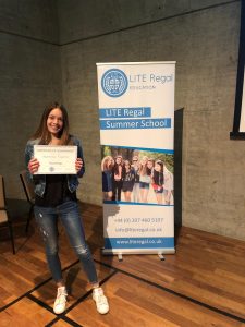 girl with certificate lite regal education